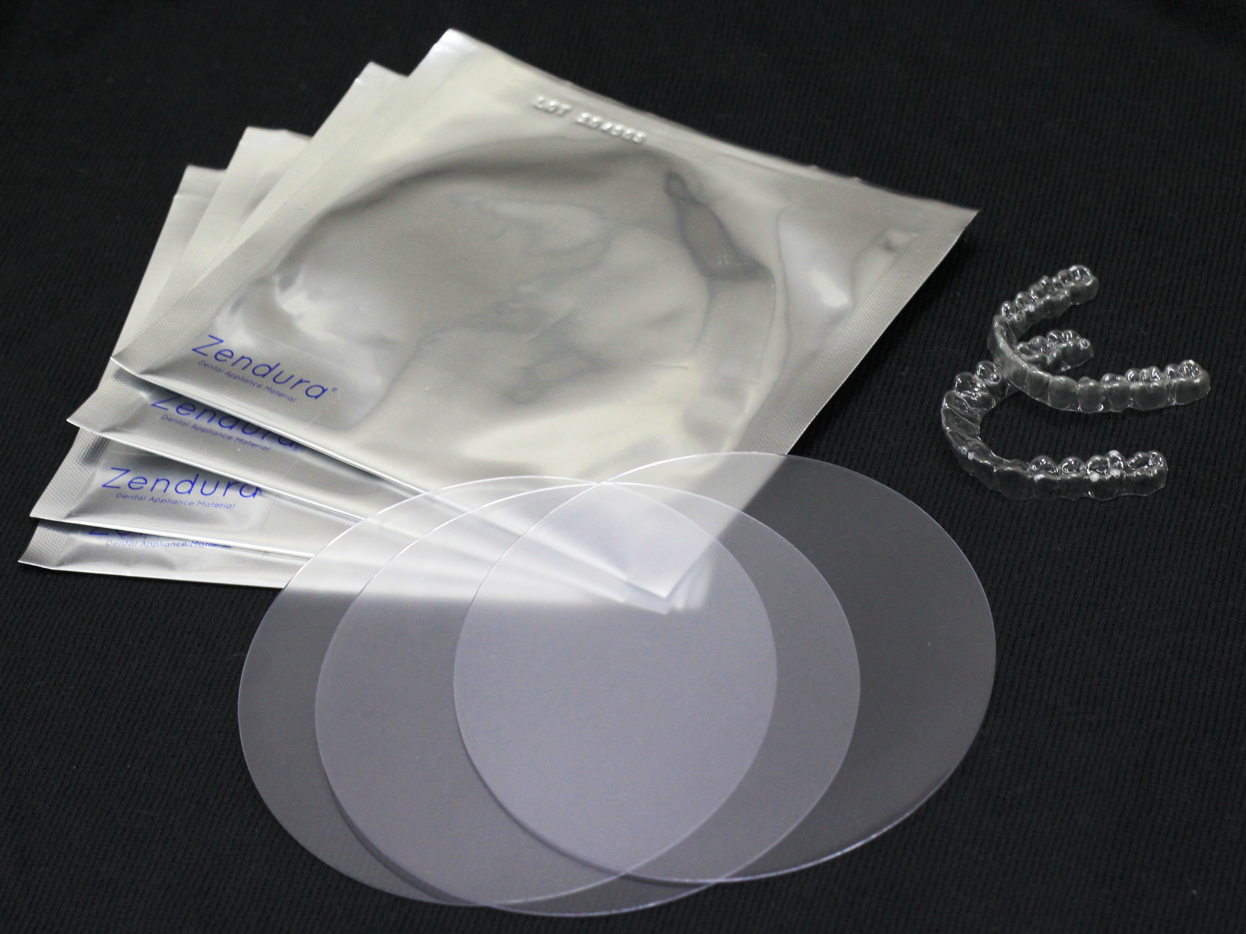 Example clear retainers and thermoforming material